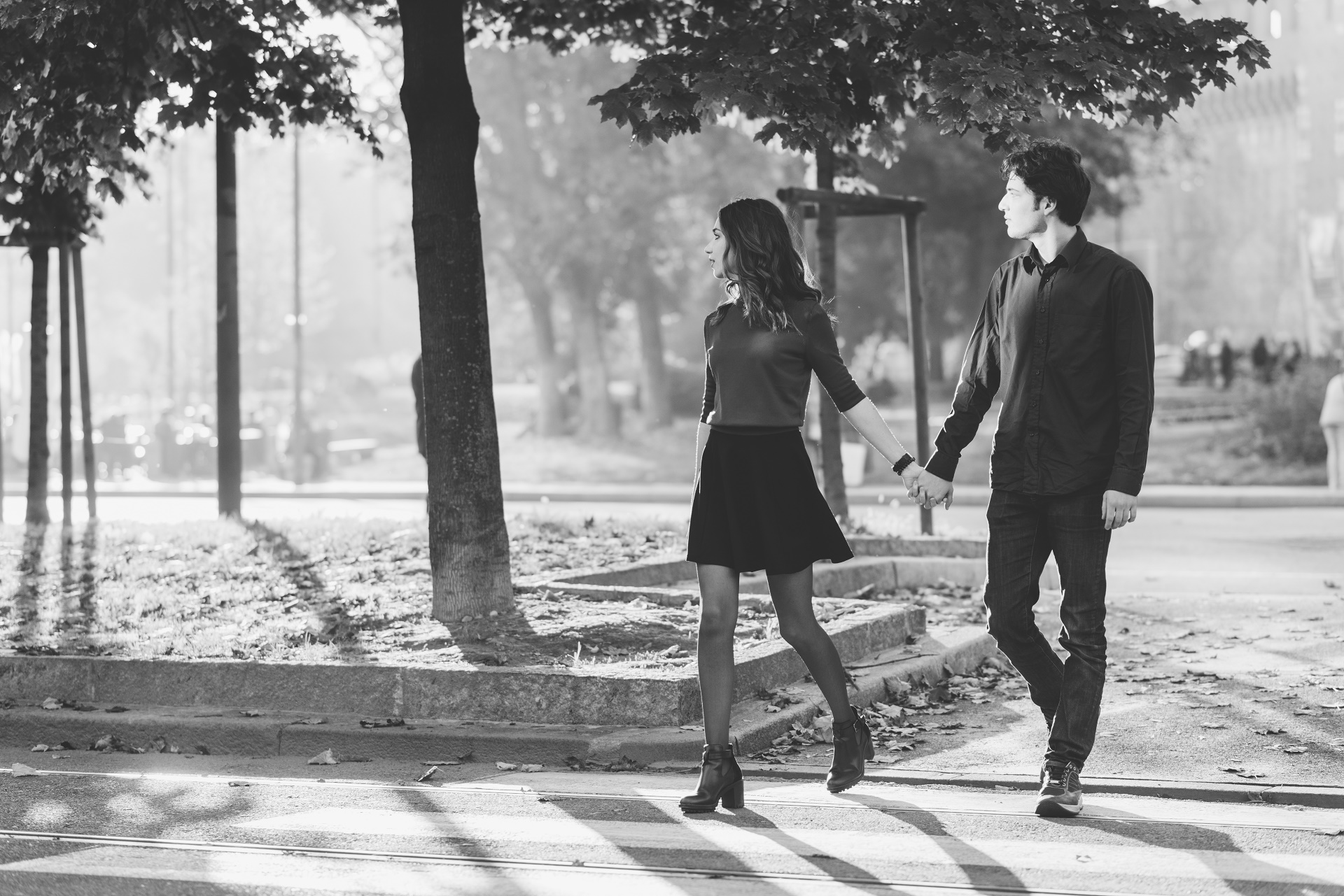 young beautiful couple in love walking hand in hand